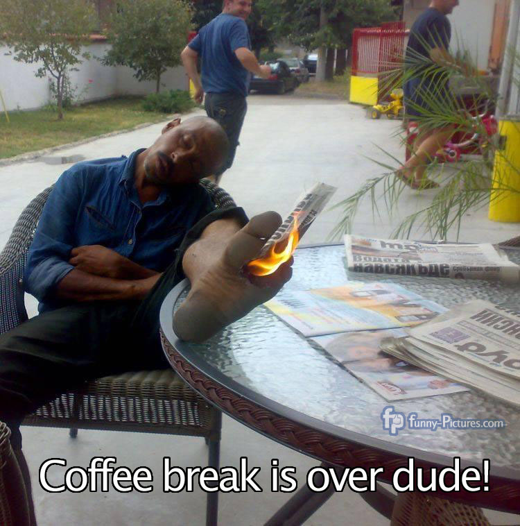 Coffee break is over dude! Guys set a newspaper on fire that is between the toes of their colleague